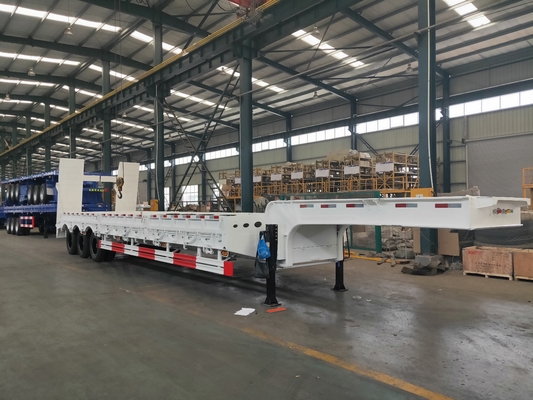 Q235 Steel 100T Low Bed Tugas Berat Semi Trailer Dalam Penangguhan Mekanis